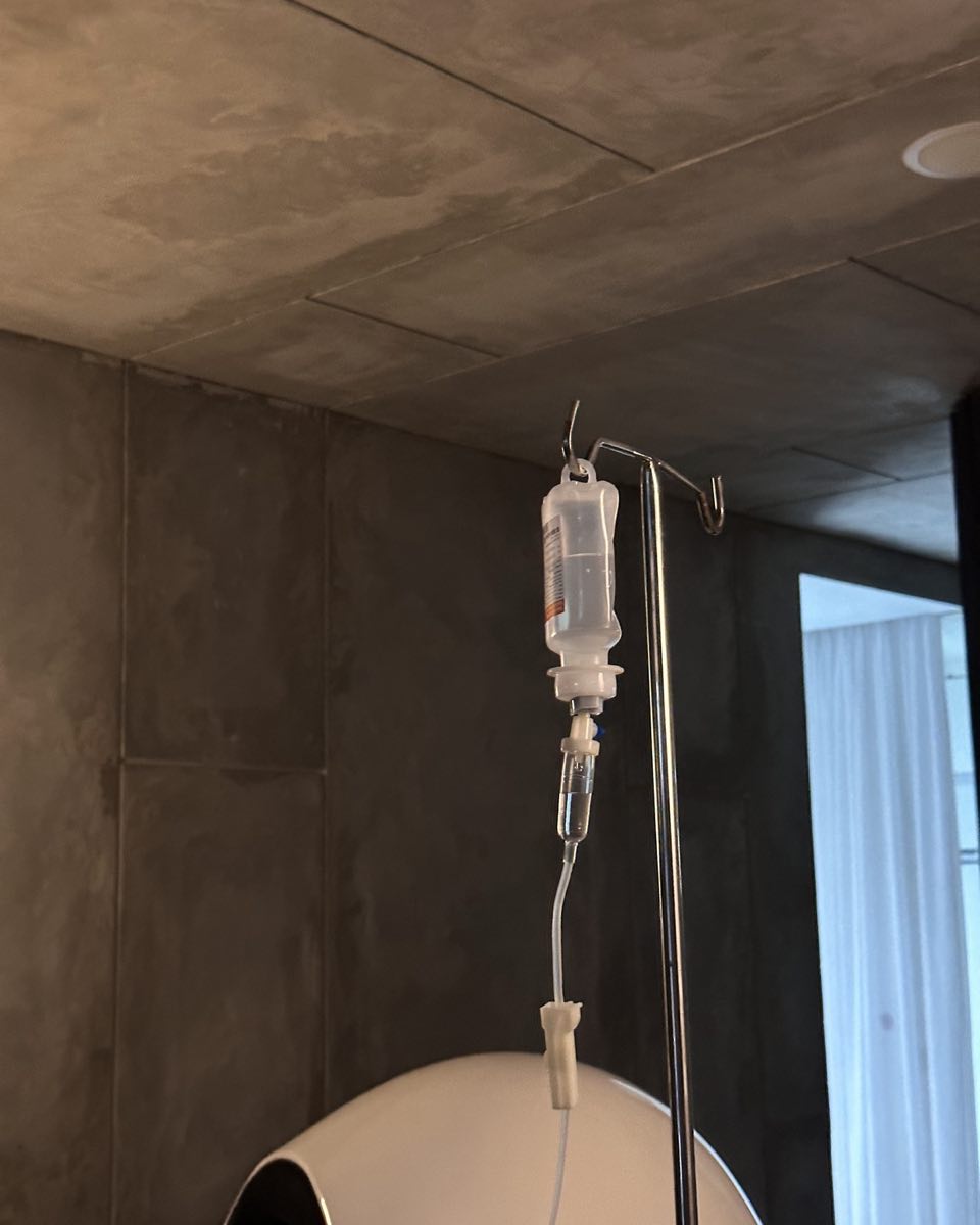A drip bag hanging from its stand