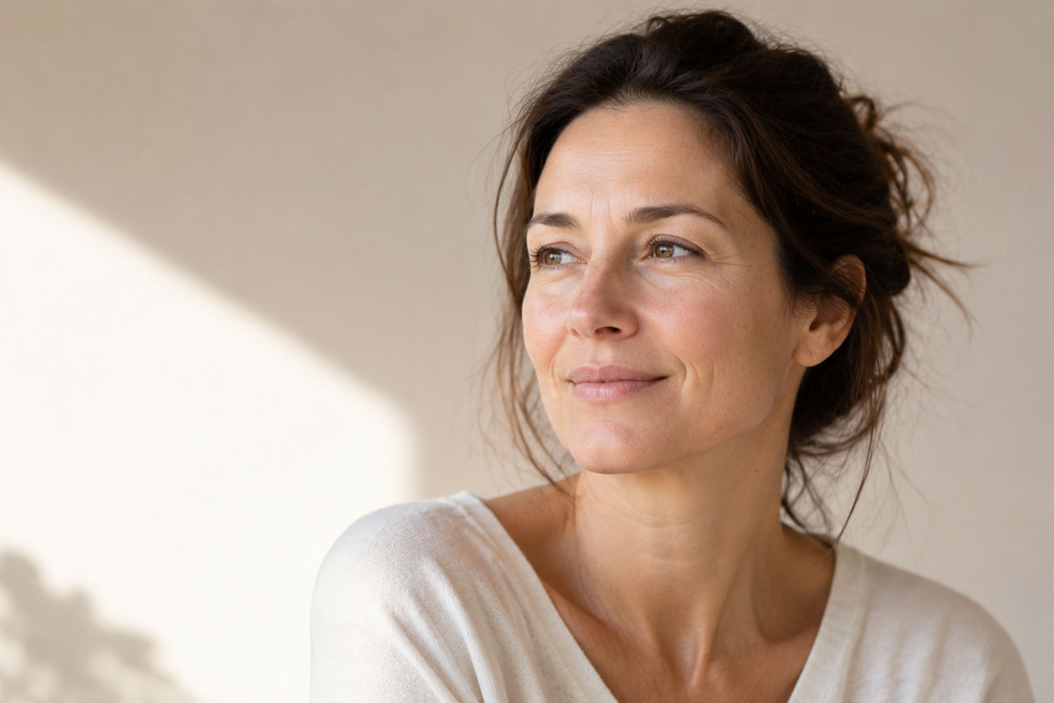 Natural woman with refreshed appearance after cheek and nasolabial fold filler treatment